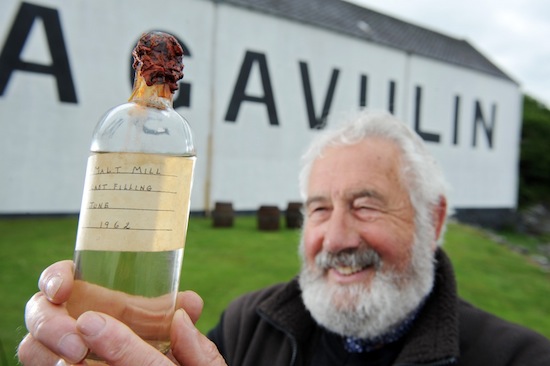 Donnie MacKinnon former head brewer at Lagavulin unveils the last remaining bottle of Malt Mill that he filled fifty years ago