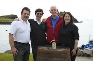 Four Lagavulin managers keep an eye on that 1911 bottle