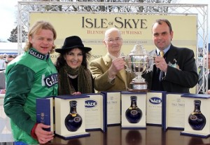 Trainer alan King (right)receives the Isle of Skye sponsored Scottish Champion Hurdle award after RAYA STAR and Choc Thornton won at Ayr